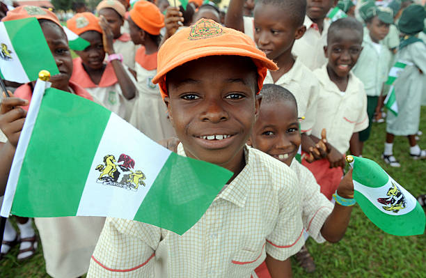 Nigerian children attend independence day celebrations in Lagos in October 1, 2013. Nigeria's president Goodluck Jonathan said he had formed a panel tasked with laying the ground for a national dialogue to tackle contentious issues such as religious tensions and the sharing of oil wealth during an address marking the 53rd anniversary of Nigeria's independence. AFP PHOTO/ PIUS UTOMI EKPEI        (Photo credit should read PIUS UTOMI EKPEI/AFP via Getty Images)